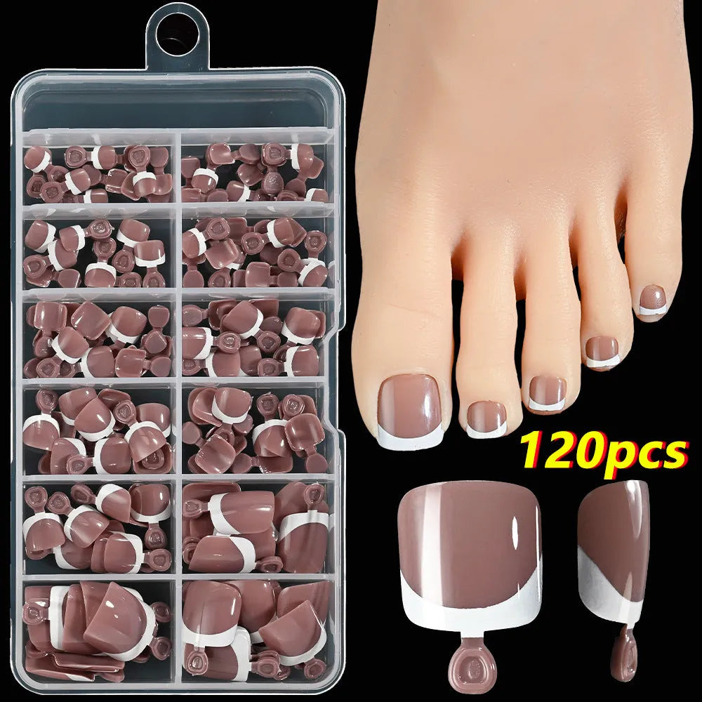 Box of 120 French white edge nude square short toe nail pieces in nine shades.