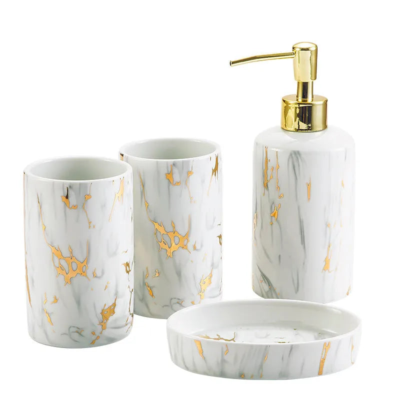 White marble ceramic bathroom wash kit with two cups, latex bottle, and soap box on a counter