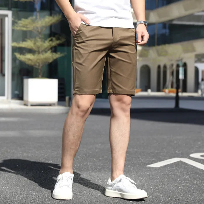 Men's loose elastic waist fifth pants in solid colour polyester, available in multiple colours including khaki and grey.