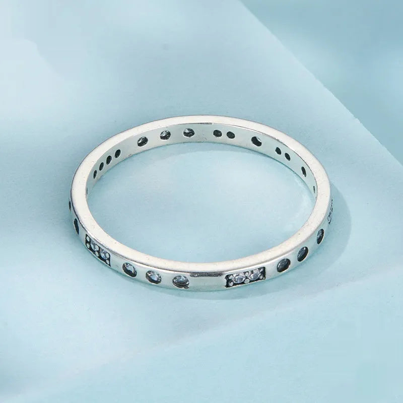 SCR1157 Moss Password I Love You oxidised black silver ring on a hand, showing simple bracelet style.