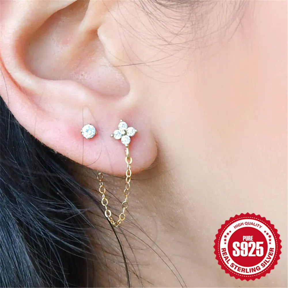 S925 sterling silver ear clip stud earrings with flower, tassel, and chain design in a gold colour.