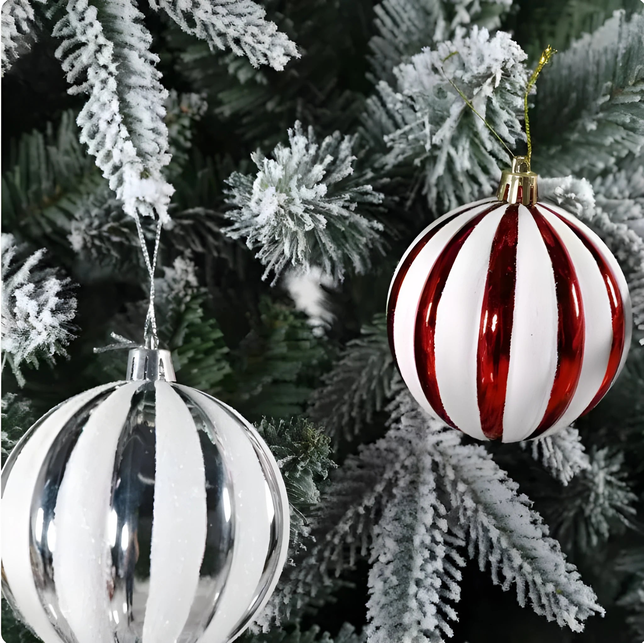 Colourful glass ball hanging ornament on a string against a white background