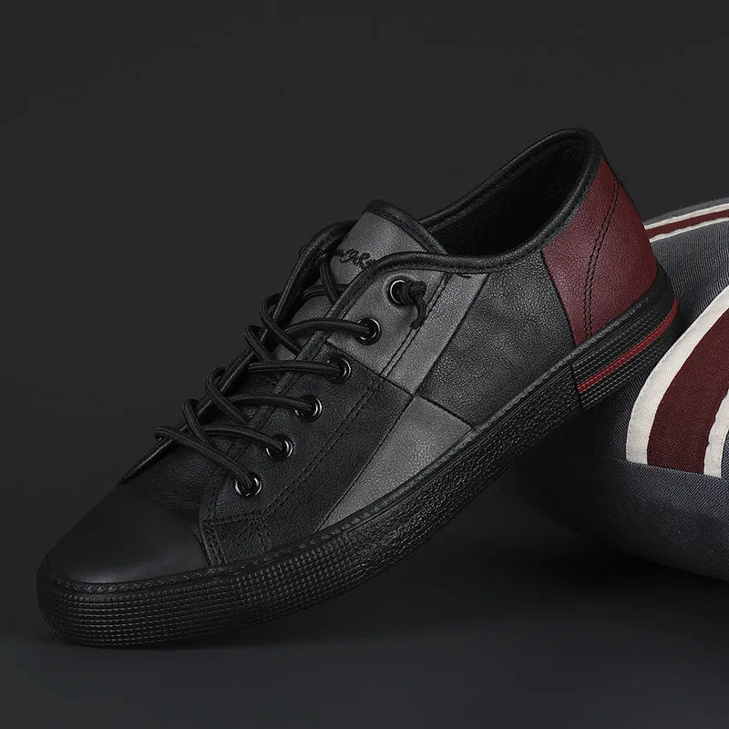 Men's black and white leather pumps with elastic band, round toe, and flat vulcanised rubber sole.