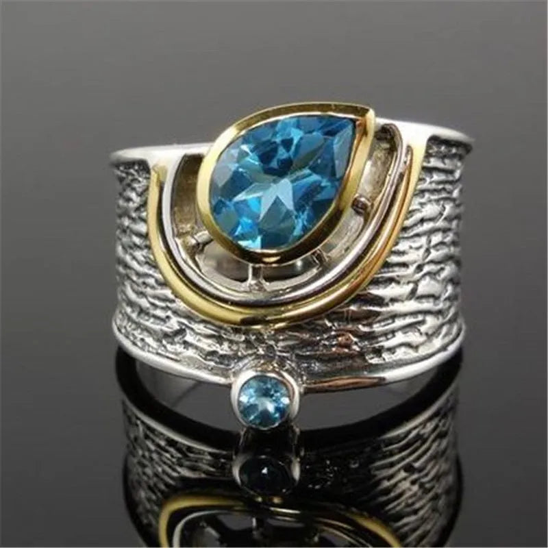 Close-up of a blue drop-shaped zircon rhinestone set in a creative Chinese style alloy women's ring.