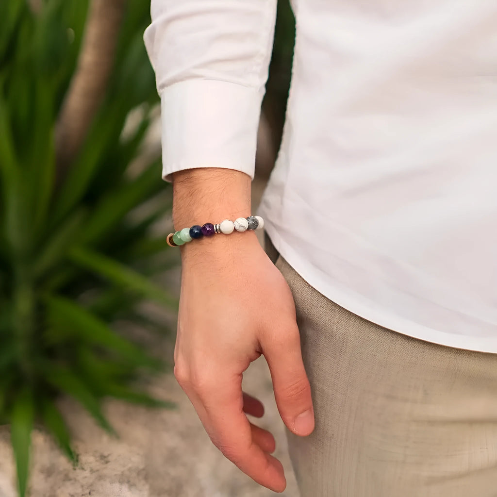 Women's flat knot braided healing bracelet with natural aquamarine stone, hand-woven geometric design on white background