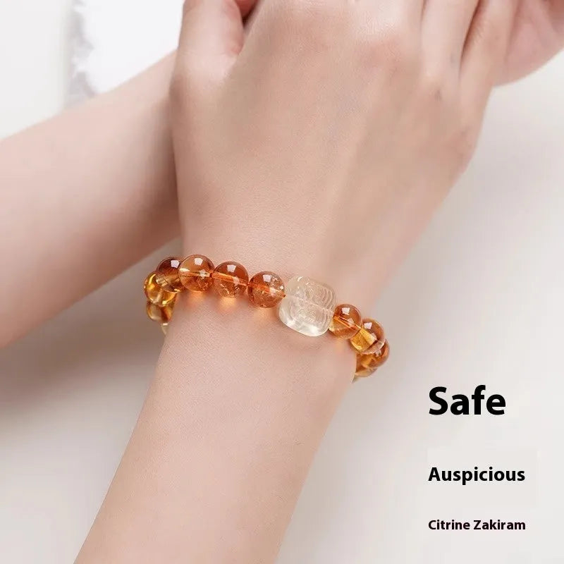 Women's ethnic style carved citrine crystal bracelet with geometric 10mm beads on a white background