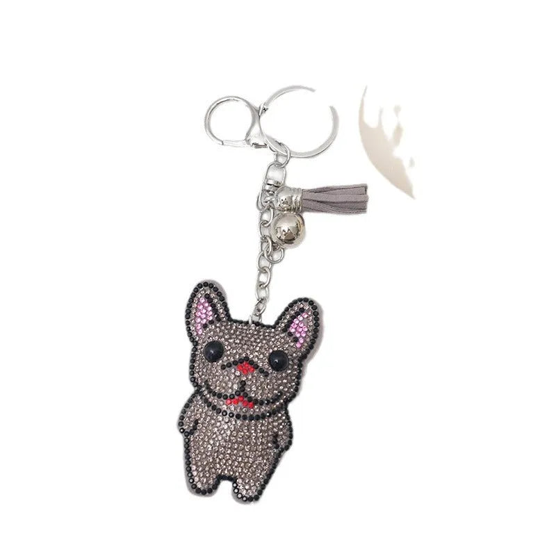 Cartoon French dog rhinestone keychain in alloy with electroplated finish.