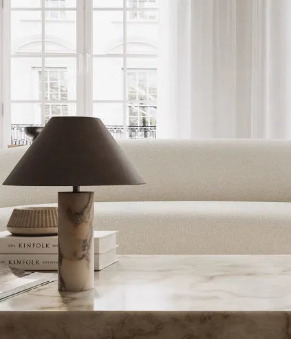 Black marble table lamp with modern minimalist design on wooden surface