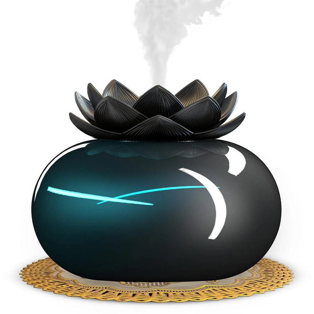 Pure black USB lotus-shaped ultrasonic humidifier and aromatherapy diffuser on a desk.