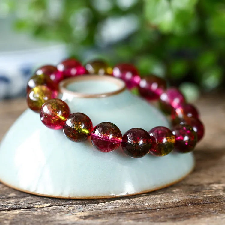 Watermelon crystal bracelet showing pastoral design on female wrist