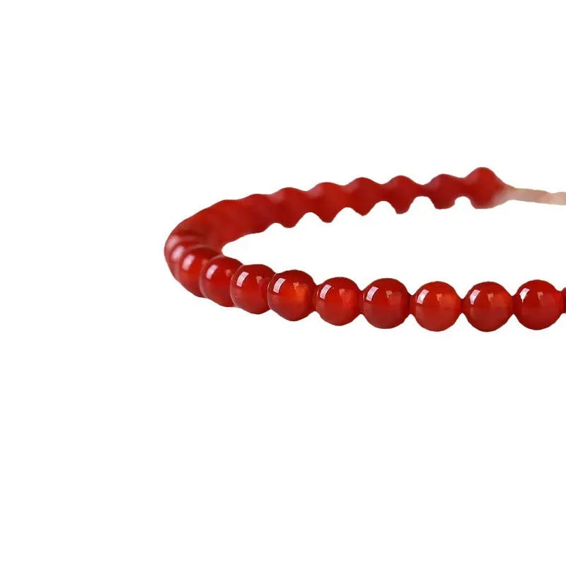 Ultra-thin red agate calm small bracelet for women classic style on neutral background