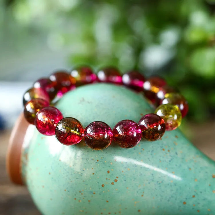 Watermelon crystal bracelet showing pastoral design on female wrist