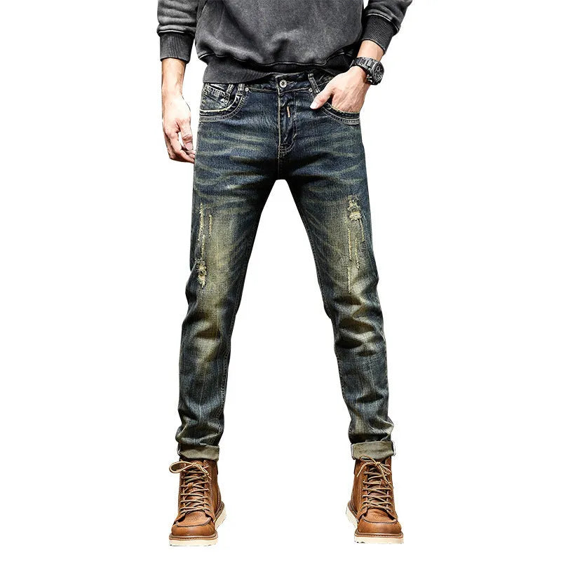 Men's skinny fit jeans in a retro blue denim wash with a zip fly closure.