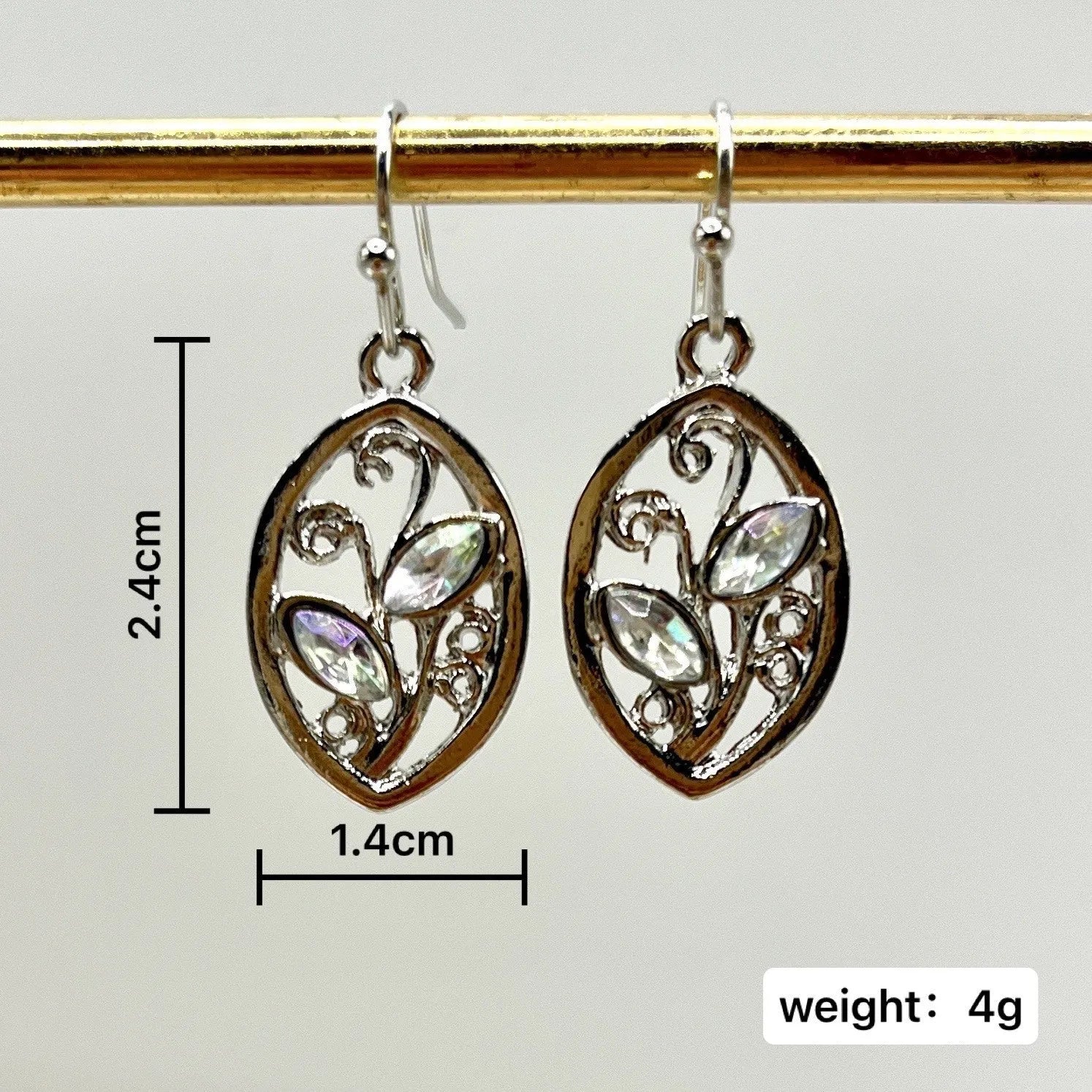 Silver alloy leaf-shaped earrings with embedded colourful moonstone gemstones and diamond-cut treatment