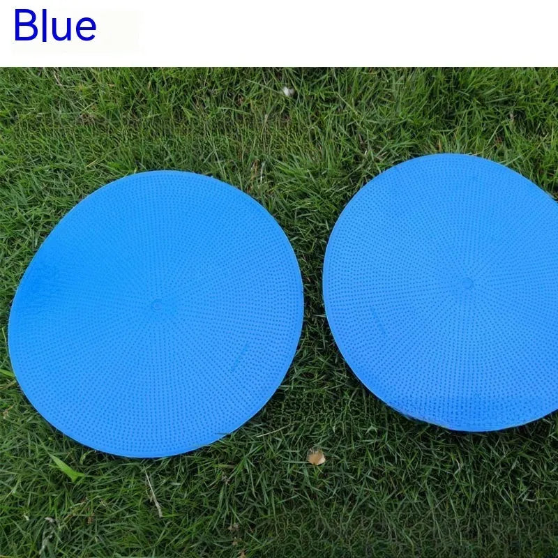 Yellow flexible TPE football training target disc, 23cm diameter, lying flat on grass.