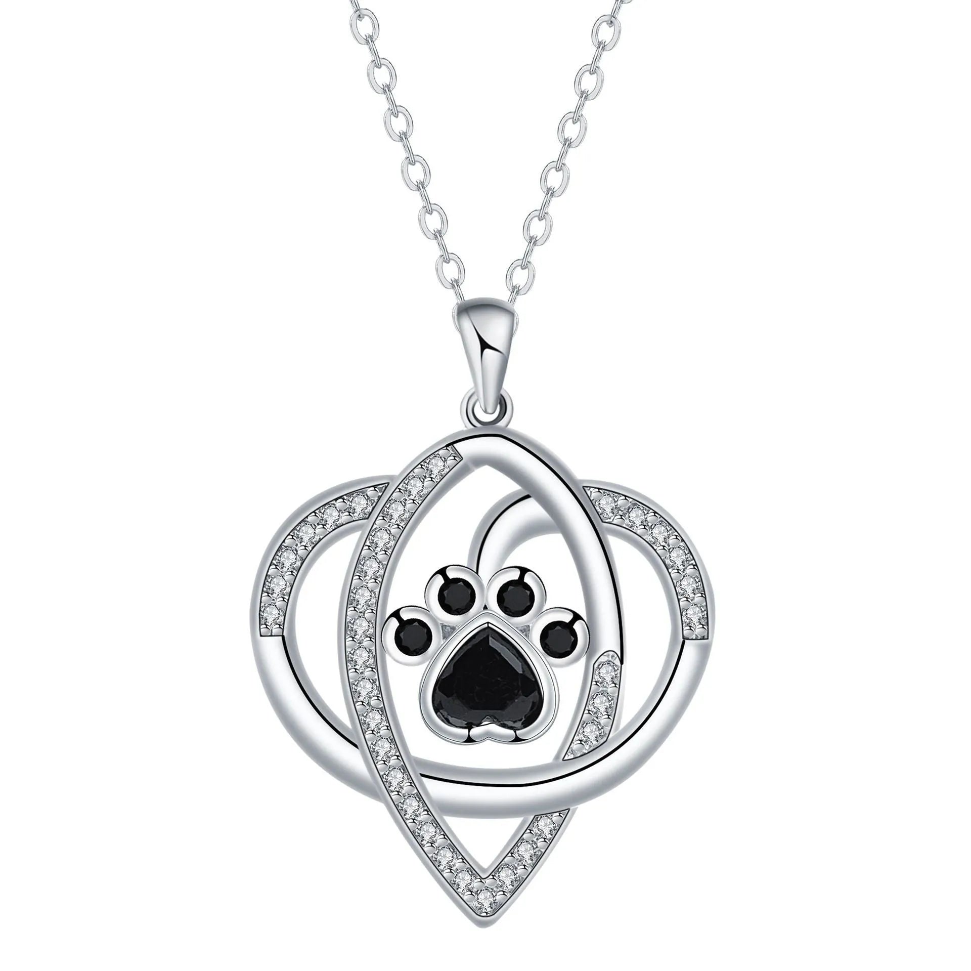 Close-up of electroplated copper paw print necklace pendant on adjustable cross chain