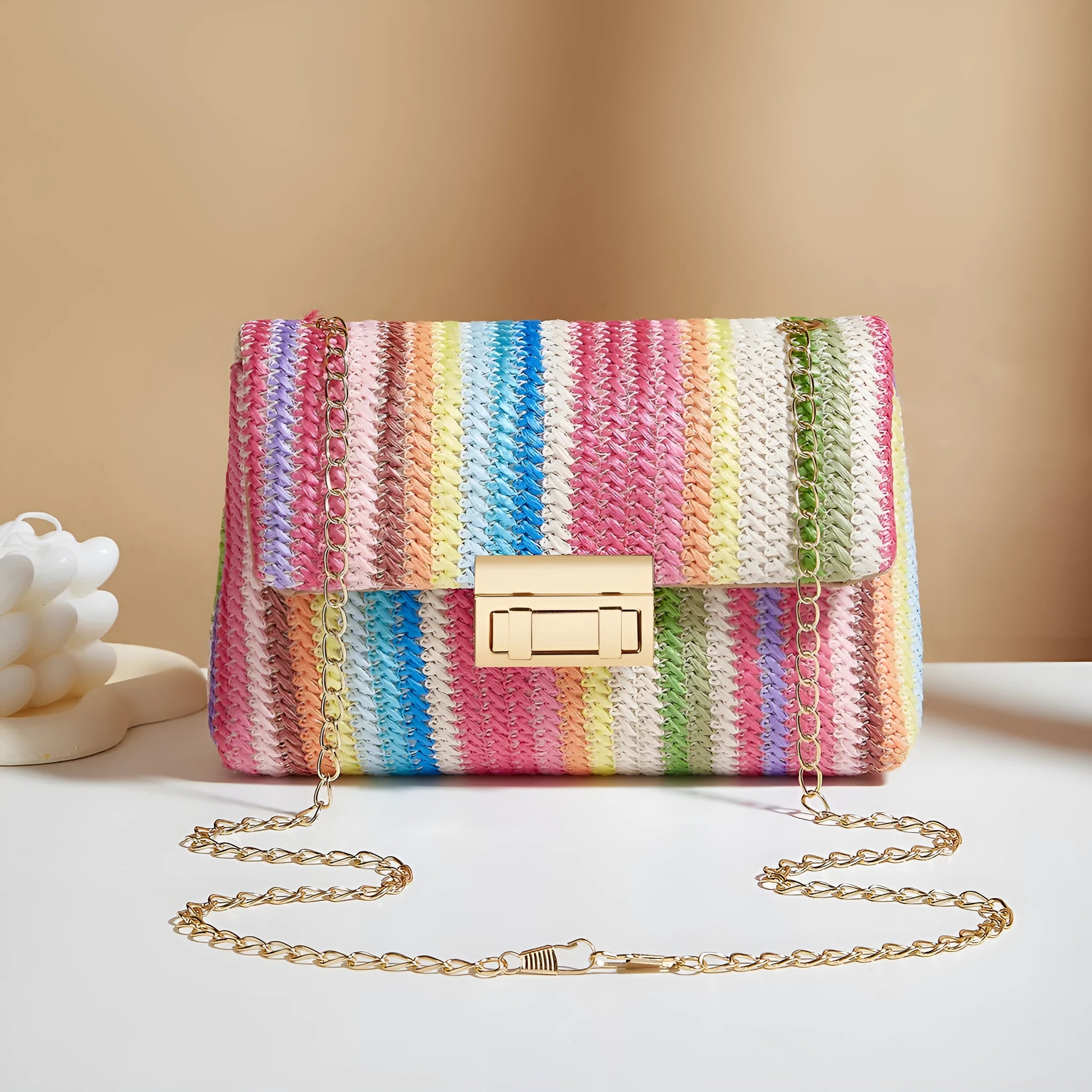 Women's straw cross-body bag in horizontal square shape, rainbow colour, with lock closure and single shoulder strap