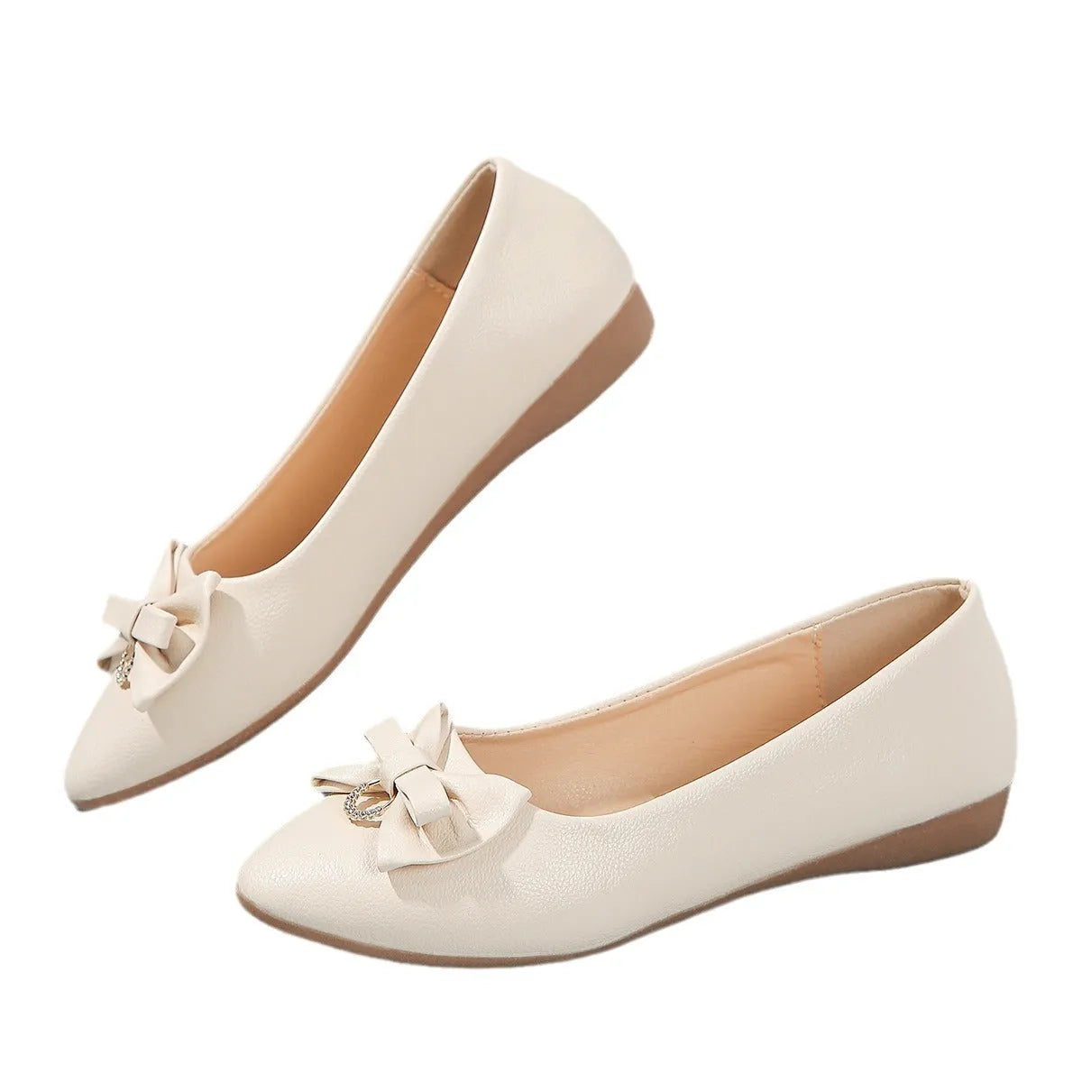 Women's beige casual flat loafers with a bowknot on the front, showing the shallow mouth and rubber sole.