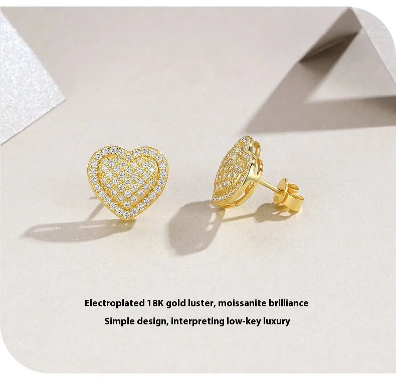 Pair of golden heart-shaped moissanite stud earrings on S925 silver posts