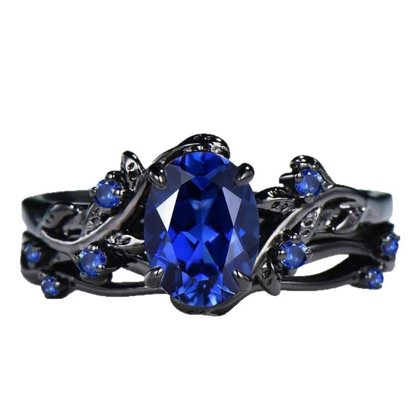 Black gun finish women's ring with navy blue rhinestone inlay on copper geometric band