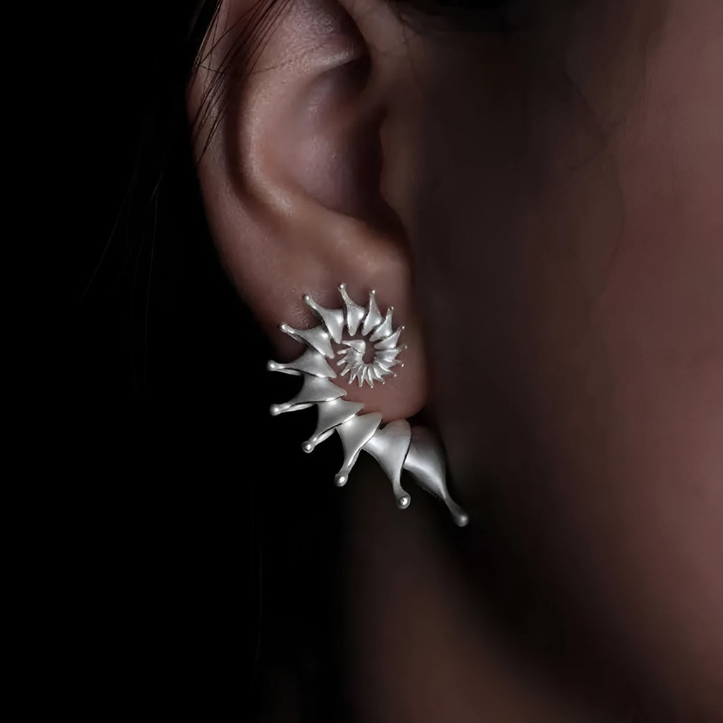 Three-dimensional conch stud earrings with matte finish and irregular design