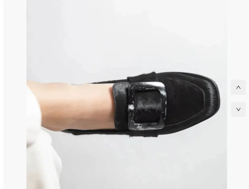 Low-cut black loafers for women with large square button and rhinestone details, round toe, low heel