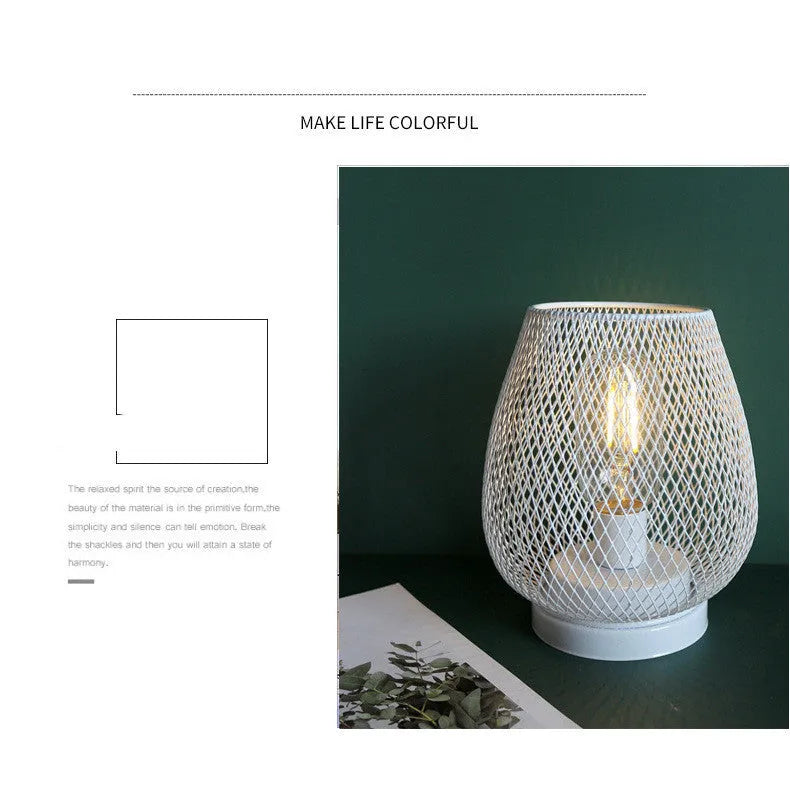 Retro iron art battery-powered table lamp with hollowed-out birdcage design in white finish