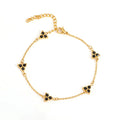 Geometric stainless steel women's bracelet with three diamond shapes and coloured stone settings.