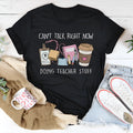 Black cotton T-shirt with short sleeves and round neckline showing loose fit design