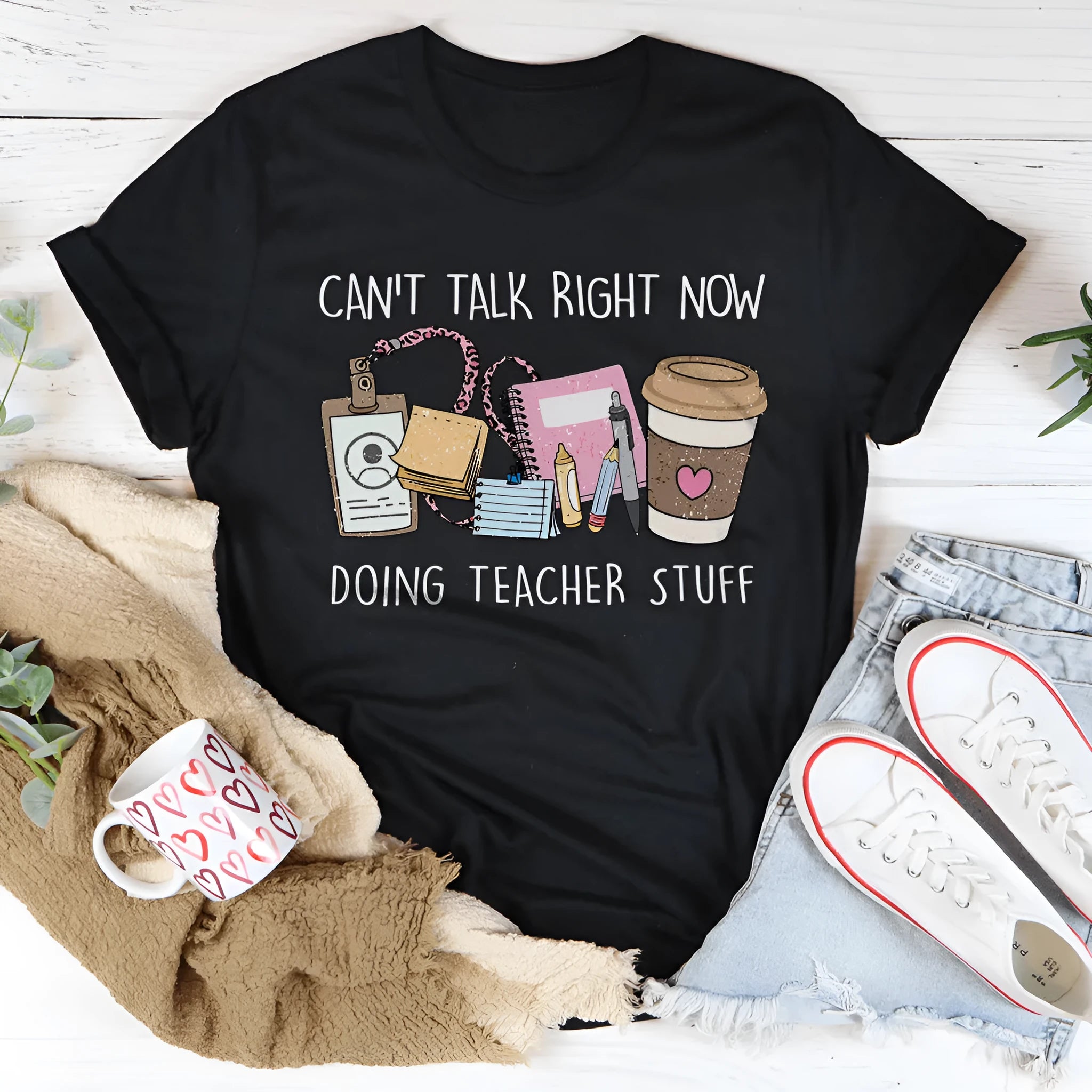 Black cotton T-shirt with short sleeves and round neckline showing loose fit design