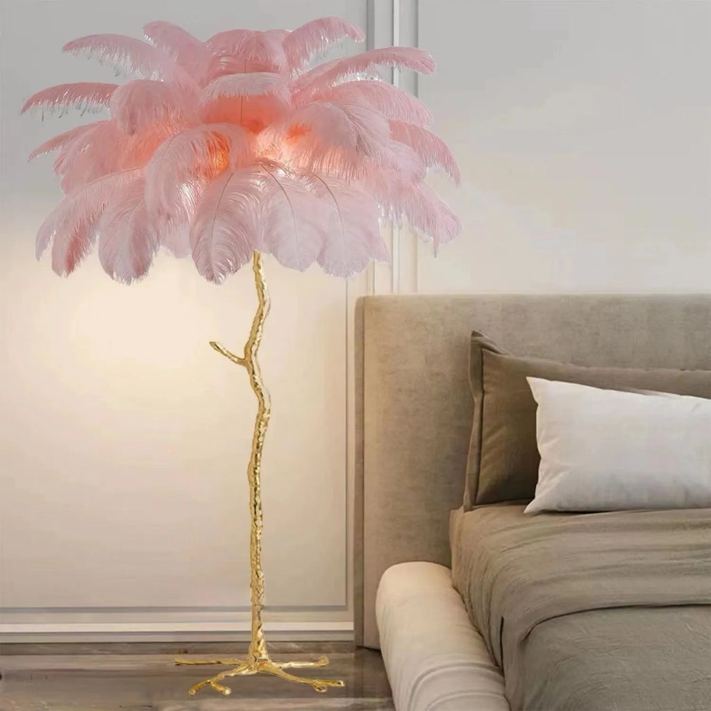 Tall white resin feather floor lamp standing in a modern living room.