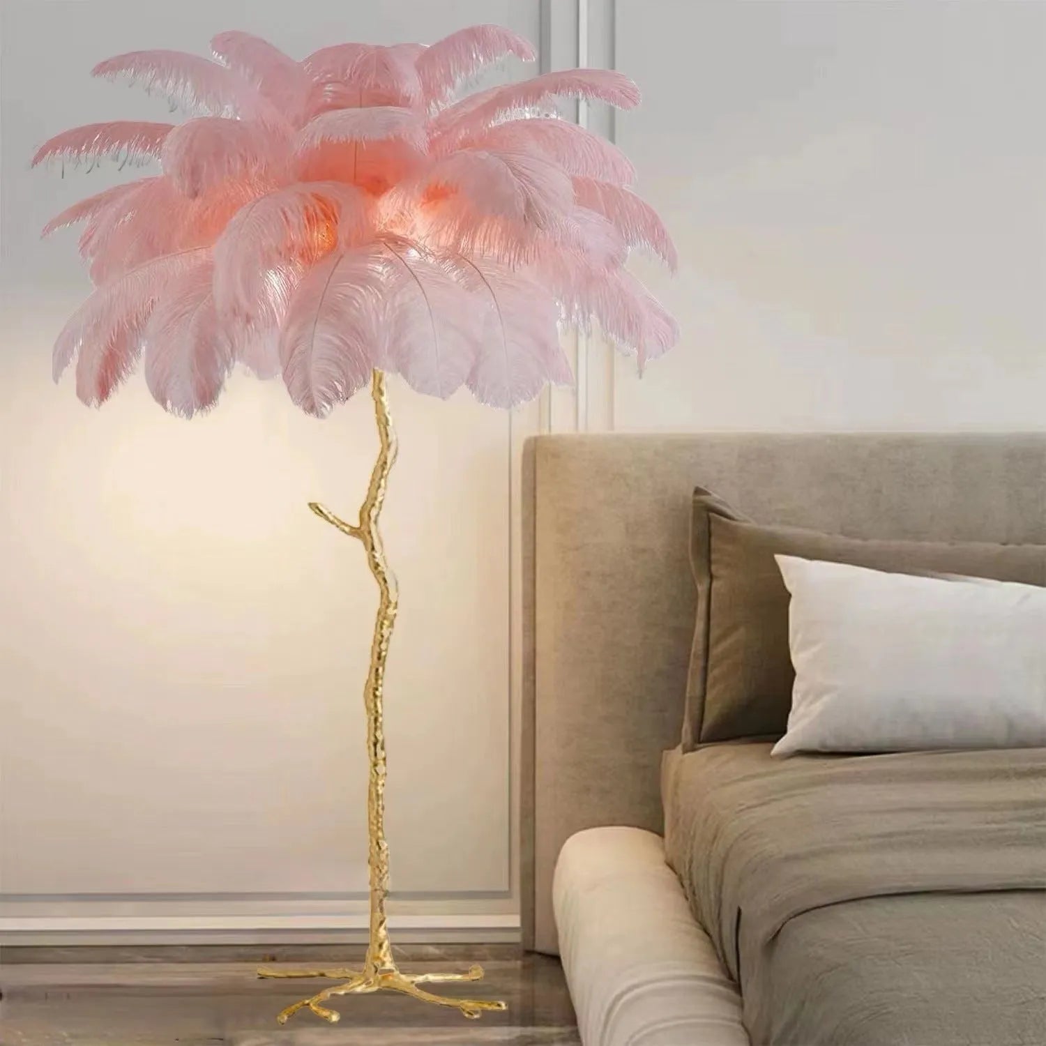 Tall white resin feather floor lamp standing in a modern living room.