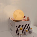 Maglev floating Moon night light with astronaut figures and USB power connection