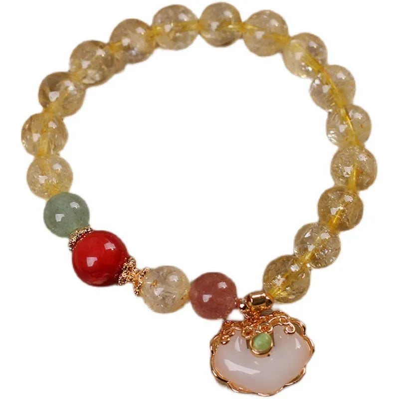 Women's yellow hair crystal jade ruyi pendant bracelet on an alloy chain.