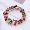 Handcrafted three-ring crystal bracelet with tourmaline, strawberry quartz and amethyst beads on adjustable cord