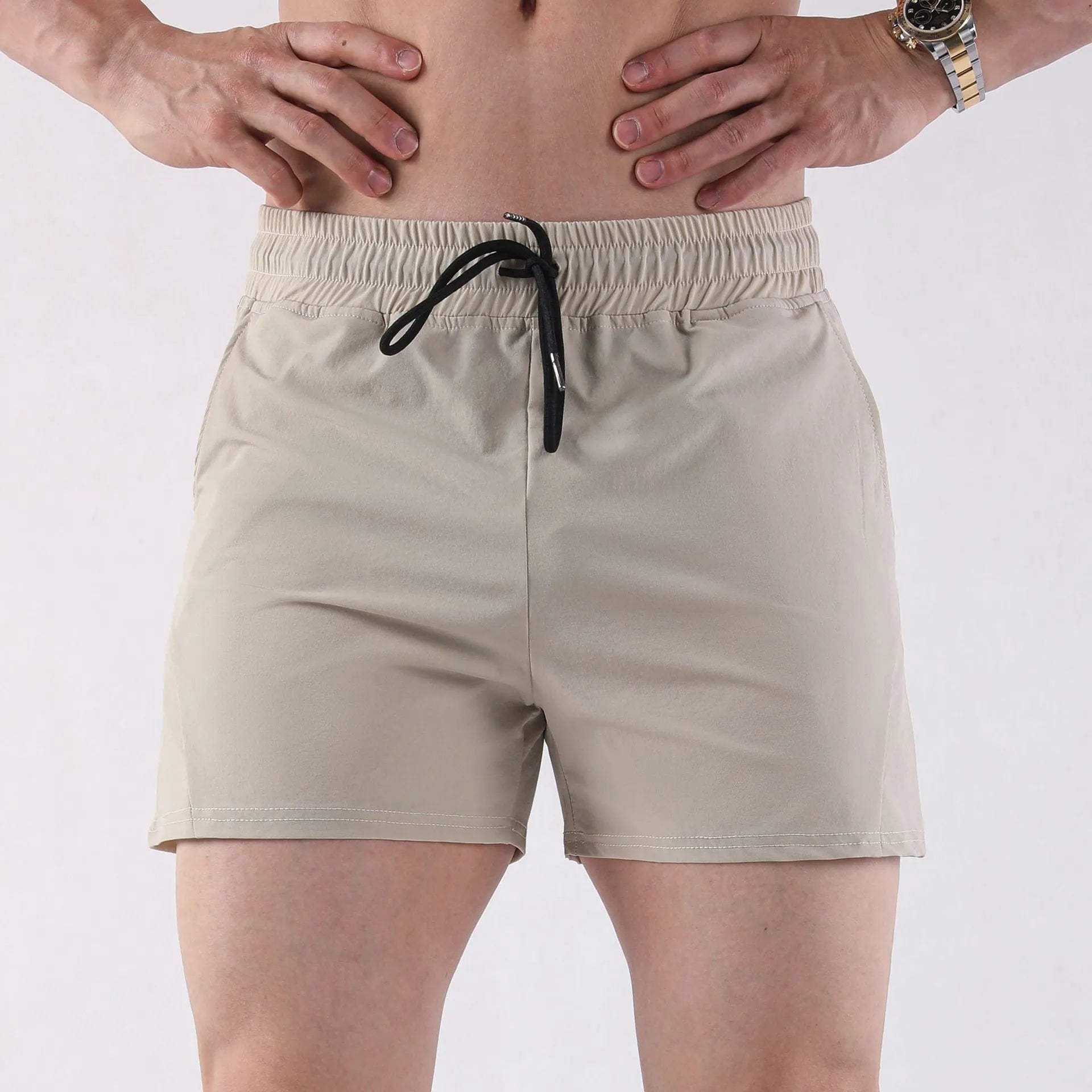 Men's polyester basketball shorts in grey, black, apricot or green with elastic waistband