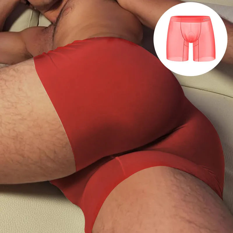 Orange seamless nylon sports boxer shorts for men on a plain background.
