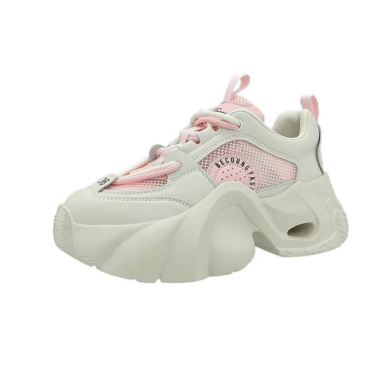 Women's pink sneakers with cross shoulder straps, thick platform sole, and breathable mesh lining.