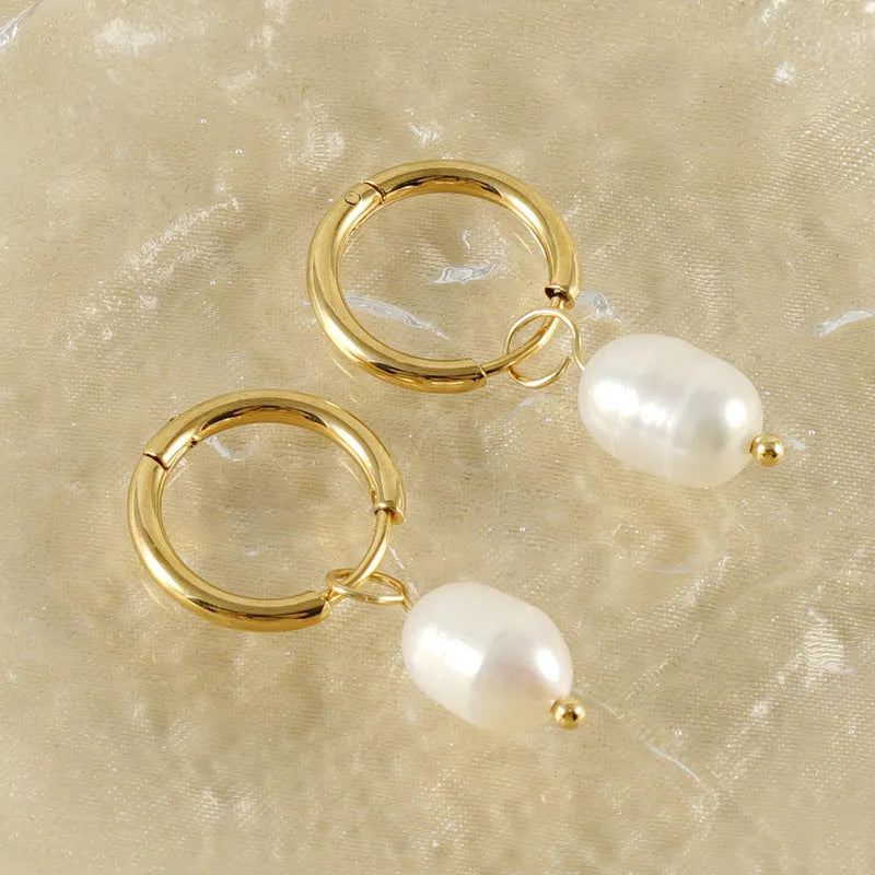 Gold geometric stainless steel earrings with pearl decorative elements