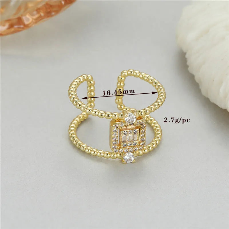 Gold-plated copper open ring with U-shaped asymmetric design and adjustable opening.