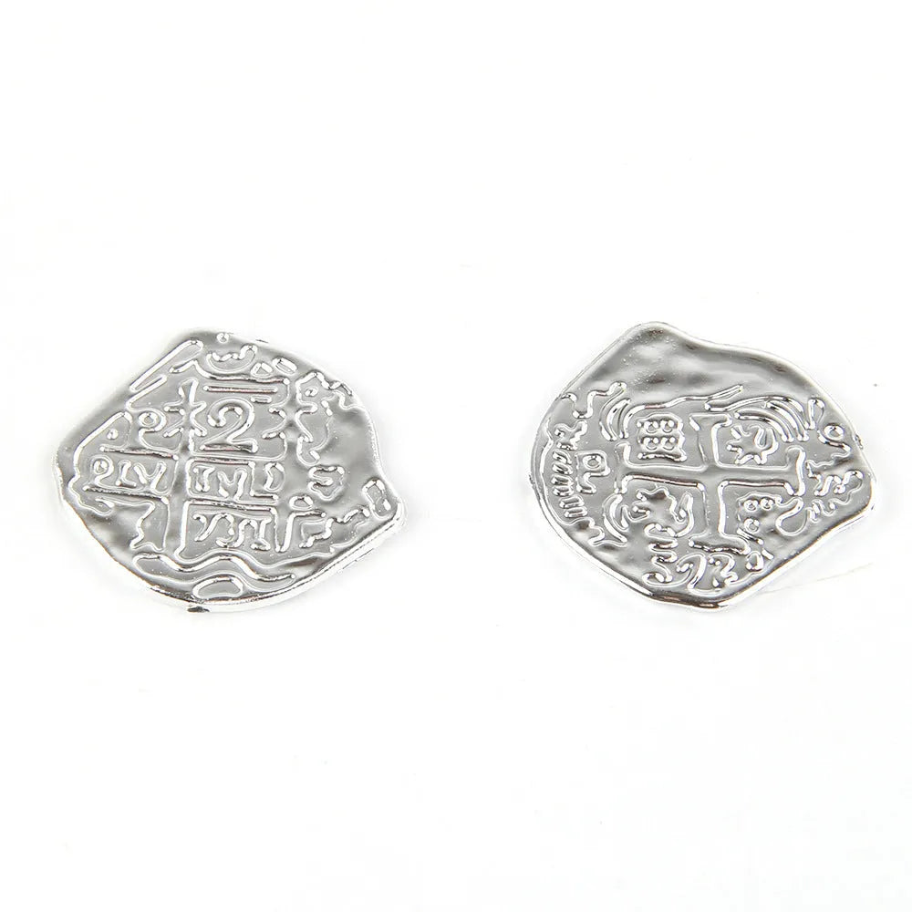 Plastic Roman coin replicas in bronze, gold, and silver electroplated finishes