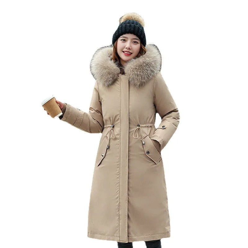 Women's long beige trench coat with a two-way zip front and fleece lining.