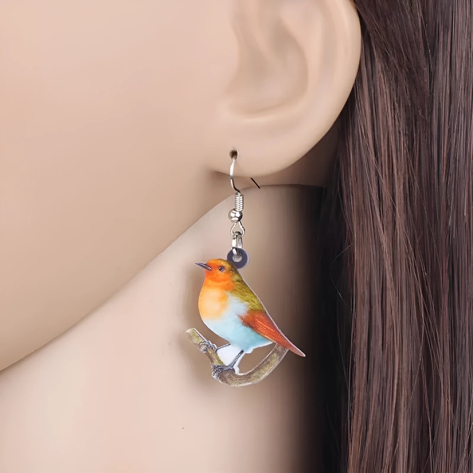 Acrylic blue titmouse pendant earrings with geometric animal zodiac designs and snake pattern details