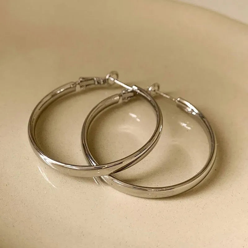 40mm circular metal earrings in gold or silver electroplated finish