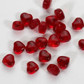 20 transparent acrylic love heart beads in assorted colours on white background