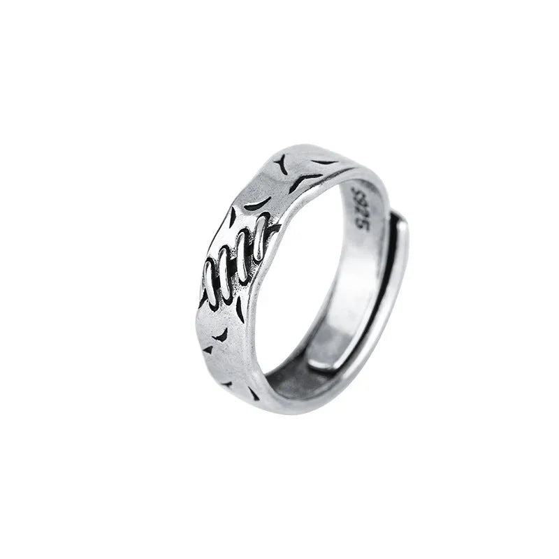 Black geometric adjustable ring with copper construction and round oval elements