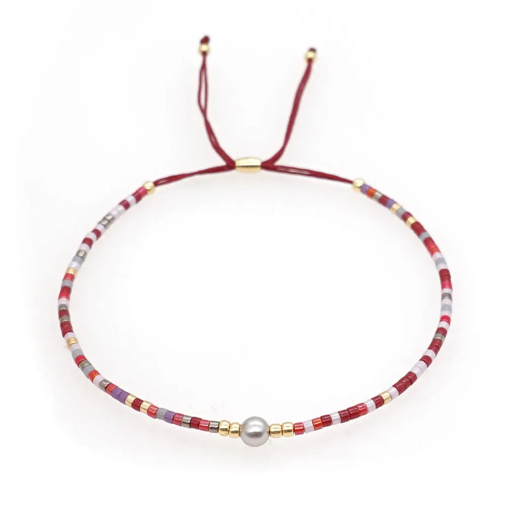 Bohemian style women's bracelet with semi-precious stone and colourful glass beads on adjustable fastening