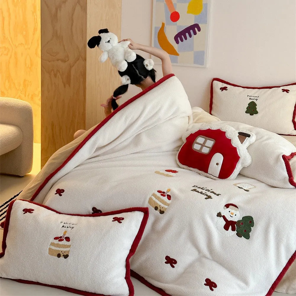 Cartoon Christmas themed bedding four-piece set for children's beds showing bed sheet, pillowcases, and duvet cover