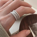 Women's copper alloy ring with woven twisted multilayer geometric design and adjustable opening