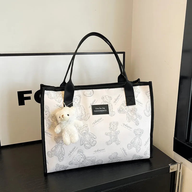 Women's large capacity canvas tote bag with rhombus pattern and sandwich pocket in black or white